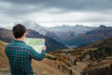 young man in the mountains. Hiking concept, lifestyle, traveler. Italian Alps, Dolomites