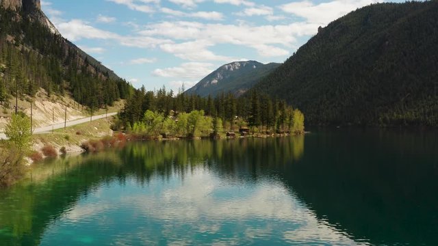 Elevated perspective view of the crystal clear water of Pavilion Lake in Marble Canyon Provincial Park, British Columbia, Canada
