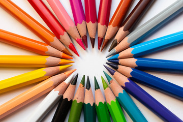 Naklejka premium colored pencils on white background