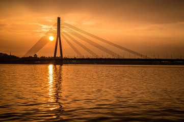 Fototapeta na wymiar Sunset in Riga over a river of Daugava