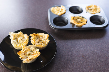 plant-based food, filo pastry cups with vegan filling just out of the oven