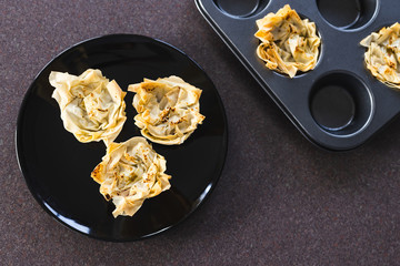 plant-based food, filo pastry cups with vegan filling just out of the oven