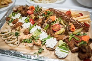 Assorted appetizer meat snacks with vegetables