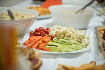 Plate of vegetables, cucumber, carrots, tomatoes