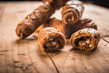 Crunchy bacon pastry rolls with sesame seeds