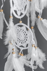 White dreamcatcher - native American amulet, boho-chic, ethnic protection. Soft focus. Closeup.