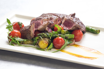 Freshly grilled steak middle raw with vegetables