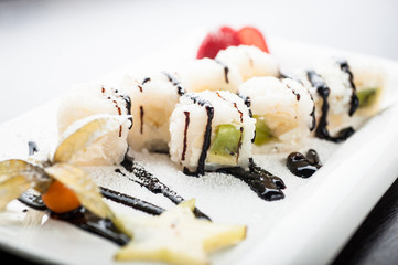 Sushi dessert fruit maki with chocolate cream