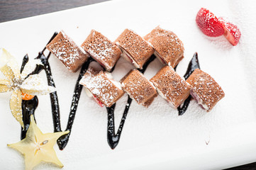 Sushi dessert creme cheese maki with strawberries