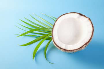 Coconut  with coconut milk  on blue ground