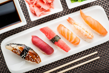 Unagi sushi in front of a nigiri plate