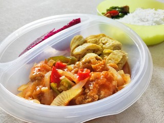 Rice, Sweet and sour shrimp, omelette and dragon fruit for lunch at the office