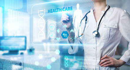Fototapeta na wymiar Modern technology in healthcare, medical diagnosis. HEALTH CARE inscription on virtual screen.