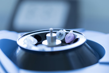 Close up of Small tube on machine mini centrifuge in laboratory, Concept science and technology,...