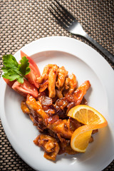 Chicken wok with carrots, onions and tomatoes