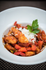Fried spicy chicken with vegetables and cheese