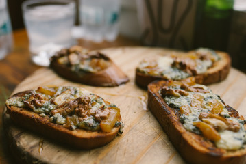 Mushrooms Bruschetta with blue cheese and walnuts in a restaurant