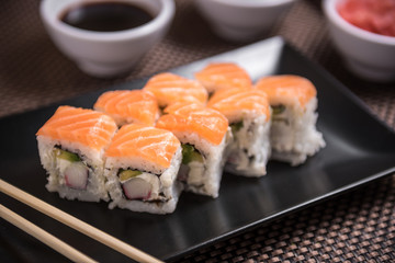 Sushi maki Hakuda maki with salmon, surimi crab