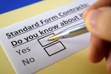 One person is answering question about standard form contracts.