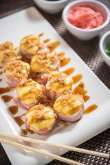 Hot sushi fritter maki with cooked salmon