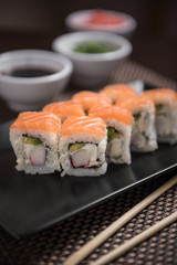 Sushi maki Hakuda maki with salmon, surimi crab