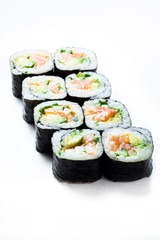 Sushi uramaki rolls with seaweed around them