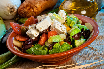Arabic salad topped with cheese.