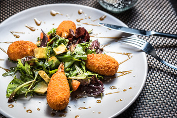 Stuffed Crab claws with fresh green lettuce