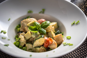 Cooked Chicken pieces with cooked vegetables