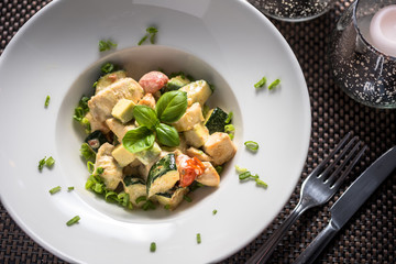 Cooked Chicken pieces with cooked vegetables