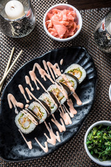 Sushi maki with tempura prawns, green salad