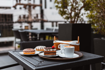 cake chocolate and donut in dish on the table.