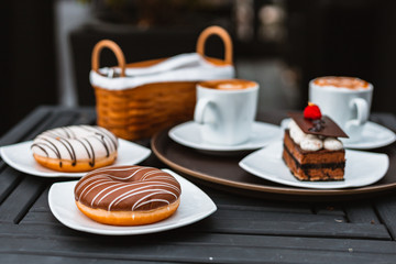 cake chocolate and donut in dish on the table.