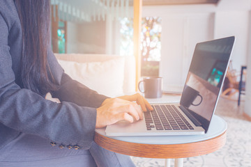 Business women hand use laptop computer.