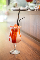Ice cream milk shake with caramel and two straws