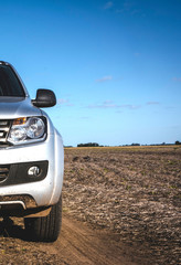 Front view of a Pick up truck in the field. Work vehicle.