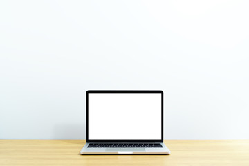Laptop computer on wood table. Laptop with blank screen. White background.