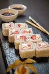 Sweet sushi rolls, strawberries, banana, chocolate