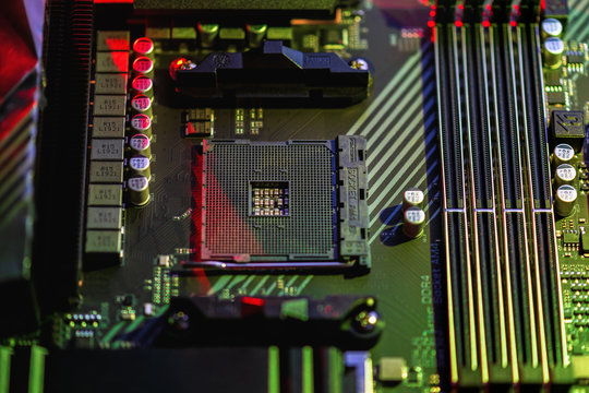 Socket am4. Close up of the AM4 socket for the motherboard with neon  red and yellow lights. The view from the top. Technological background. .