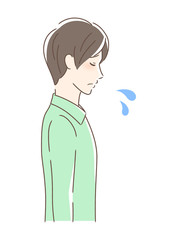 悲しむ男性の横顔