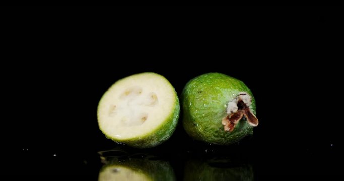 On the whole and a half feijoa falling water drops.