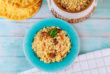 Spicy mexican yellow rice with beef and carrots.