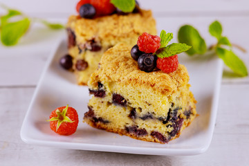Berry coffee cake on white background.