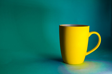 Yellow mug on a blue background