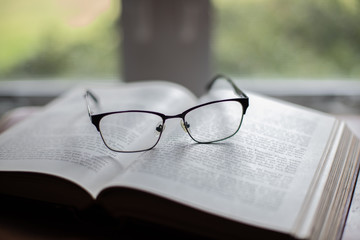 glasses on book