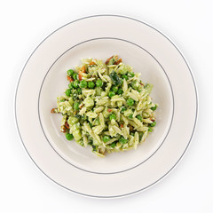 Orzo Pasta with peas and nuts on a white plate.