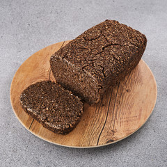 Loaf of freshly baked bread on a cutting board.