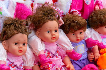 Fototapeta premium Beautiful cute baby dolls for sale at retail shop at Christmas market, New Market area, Kolkata, West Bengal, India.