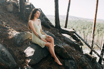 Forest nymph, portrait in the sun. Beauty portrait of a sexy girl. Beautiful girl in a Sunny spring forest.