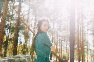 Forest nymph, portrait in the sun. Beauty portrait of a sexy girl. Beautiful girl in a Sunny spring forest.